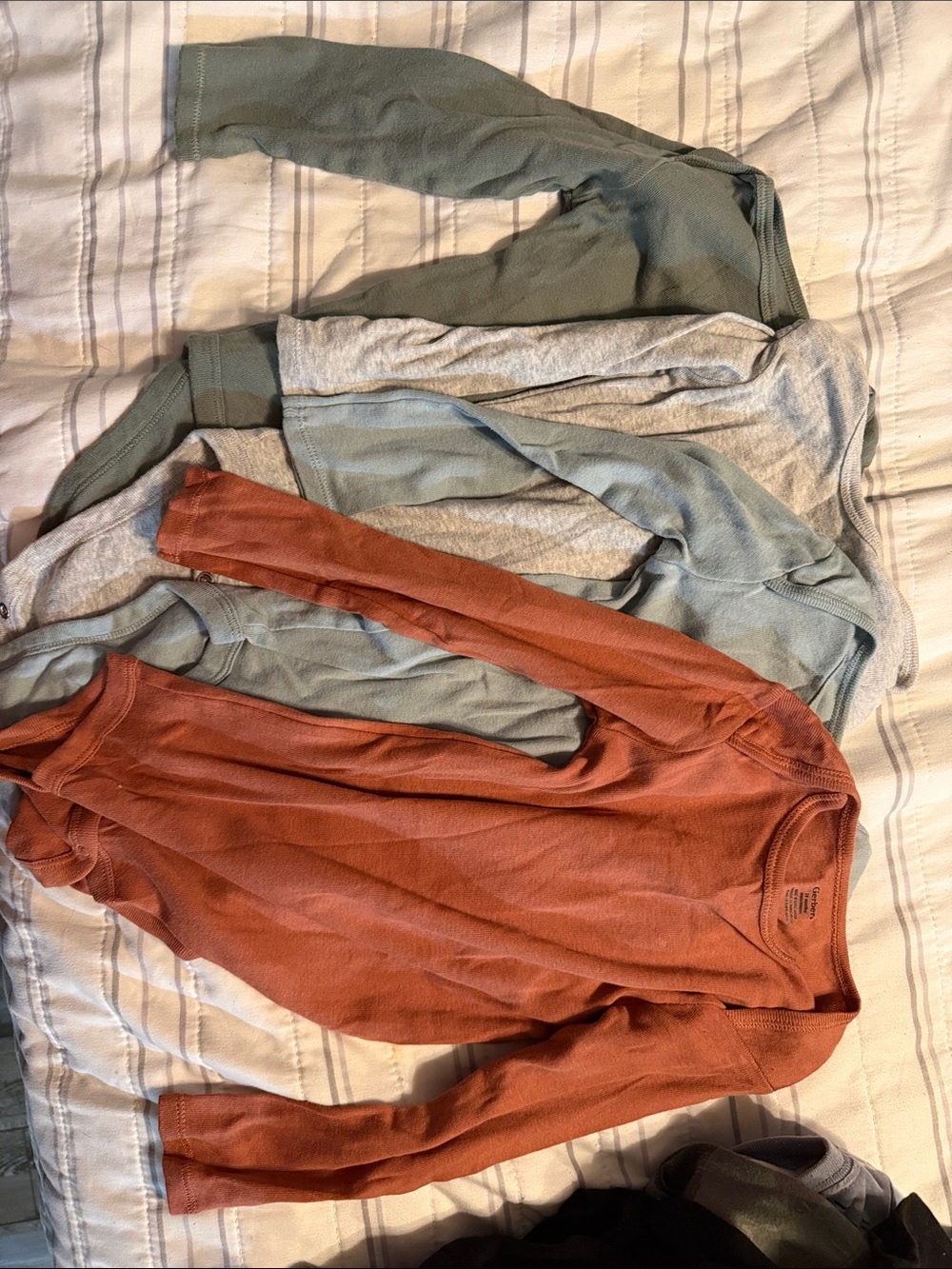 Gerber Long-Sleeve Onesies in Rust Orange, Sage Green, Light Gray